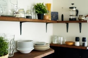 dishes on open shelves in the kitchen