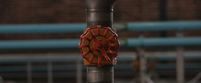 gray pipe and red valve