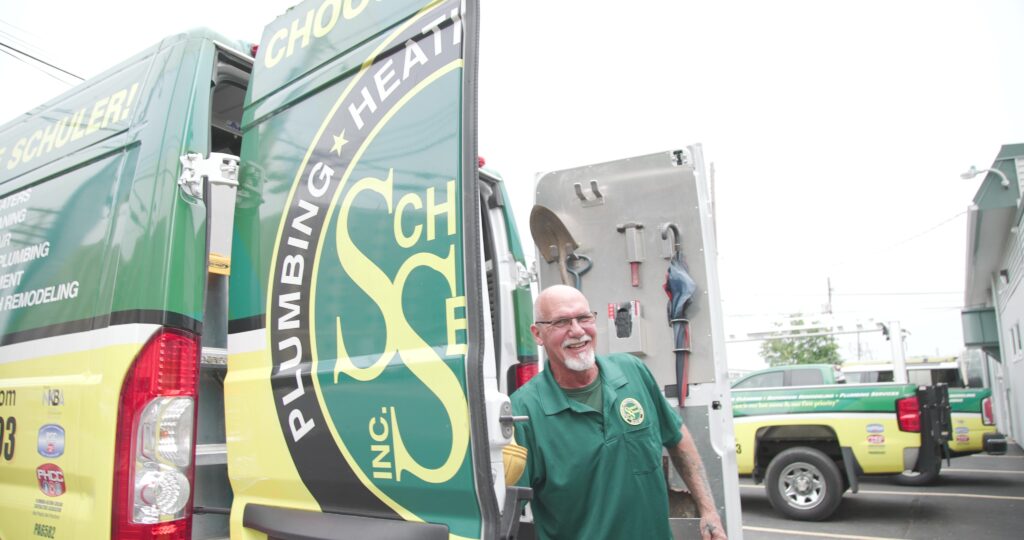 Schuler Service employee opening the door to a service truck.